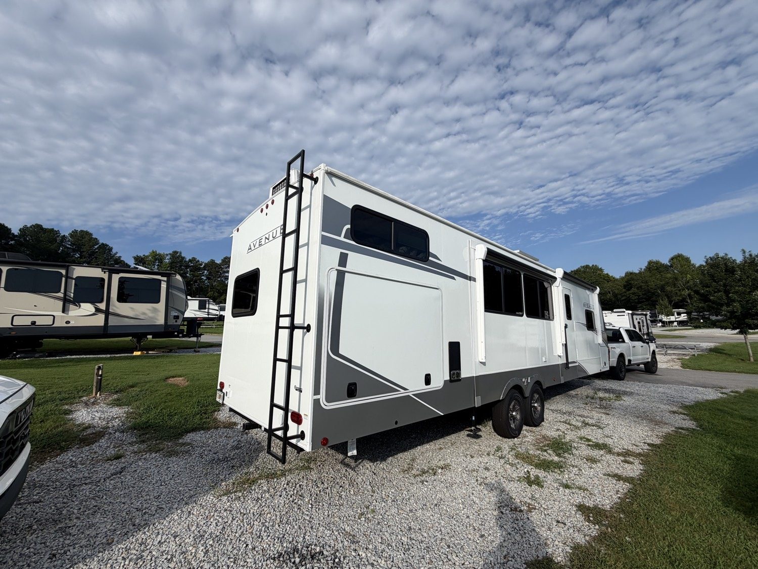 Fifth-wheel camper on a pad, ready for setup