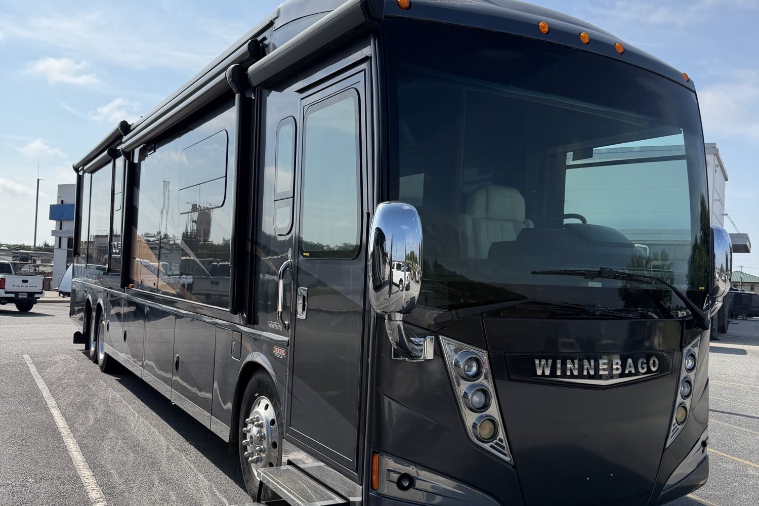 Dark Winnebago Class A motorhome ready for transport